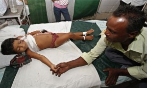 Khatun is being comforted by her grandfather inside a hospital in Guwahati